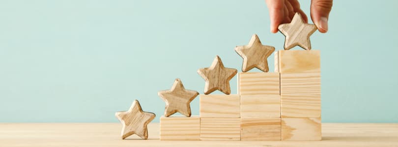 Lawyer reviewing documents at a desk with a laptop.